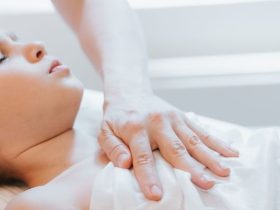 doctor osteopath hands does physiological and emotional therapy for eight year old kid girl. pediatric osteopathy treatment session. alternative medicine. taking care of the child's health. banner